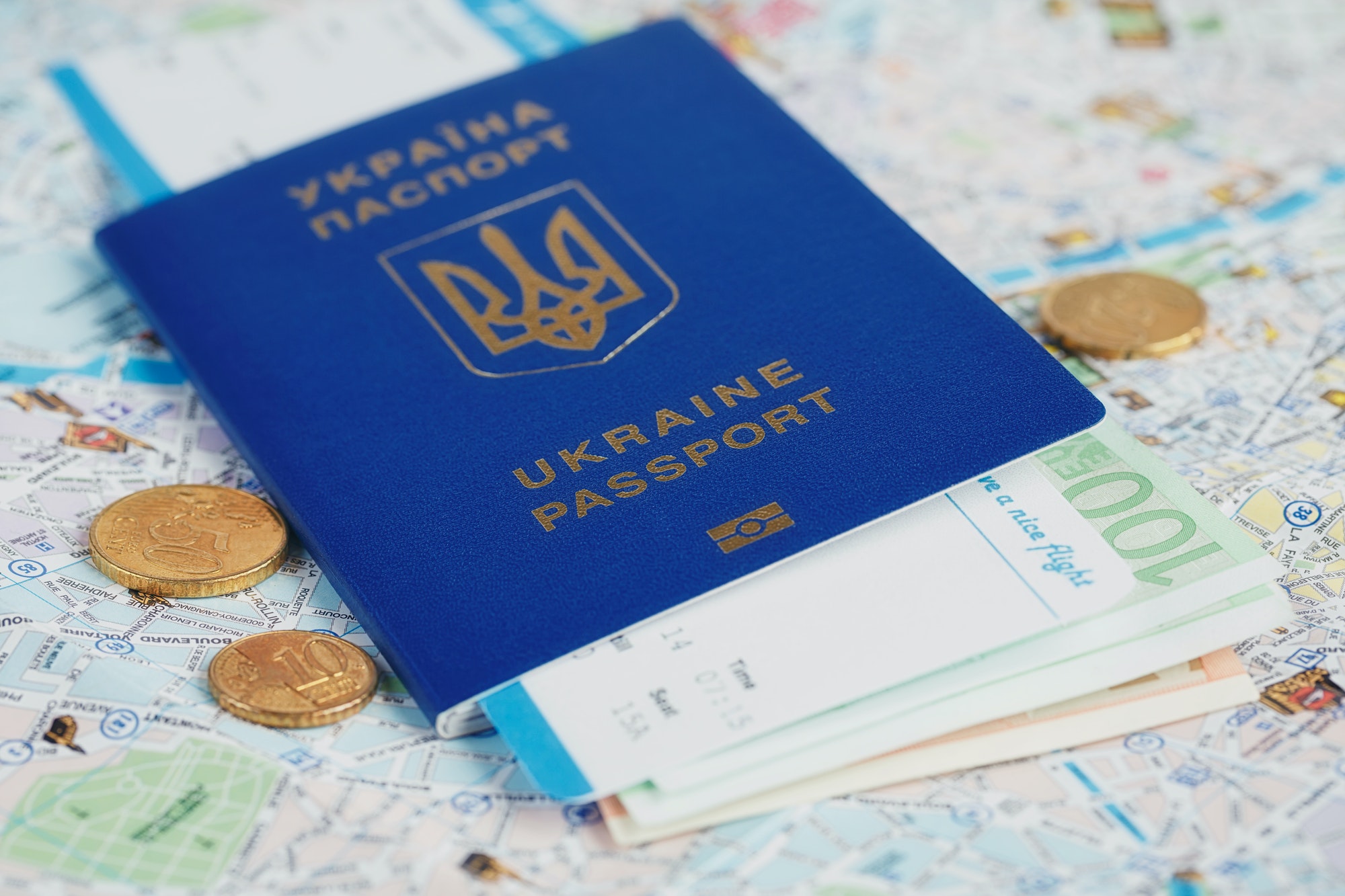Ukrainian passport and money on map